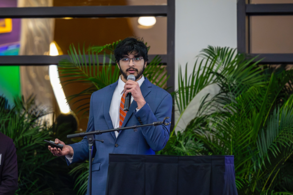 An Honors engineering undergrad presenting at the College of Engineering's AI Showcase at the end of the fall 2025 semester